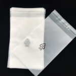 Self-adhesive printed transparent plastic bags