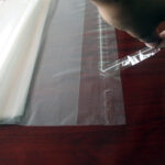 Self-adhesive printed transparent plastic bags